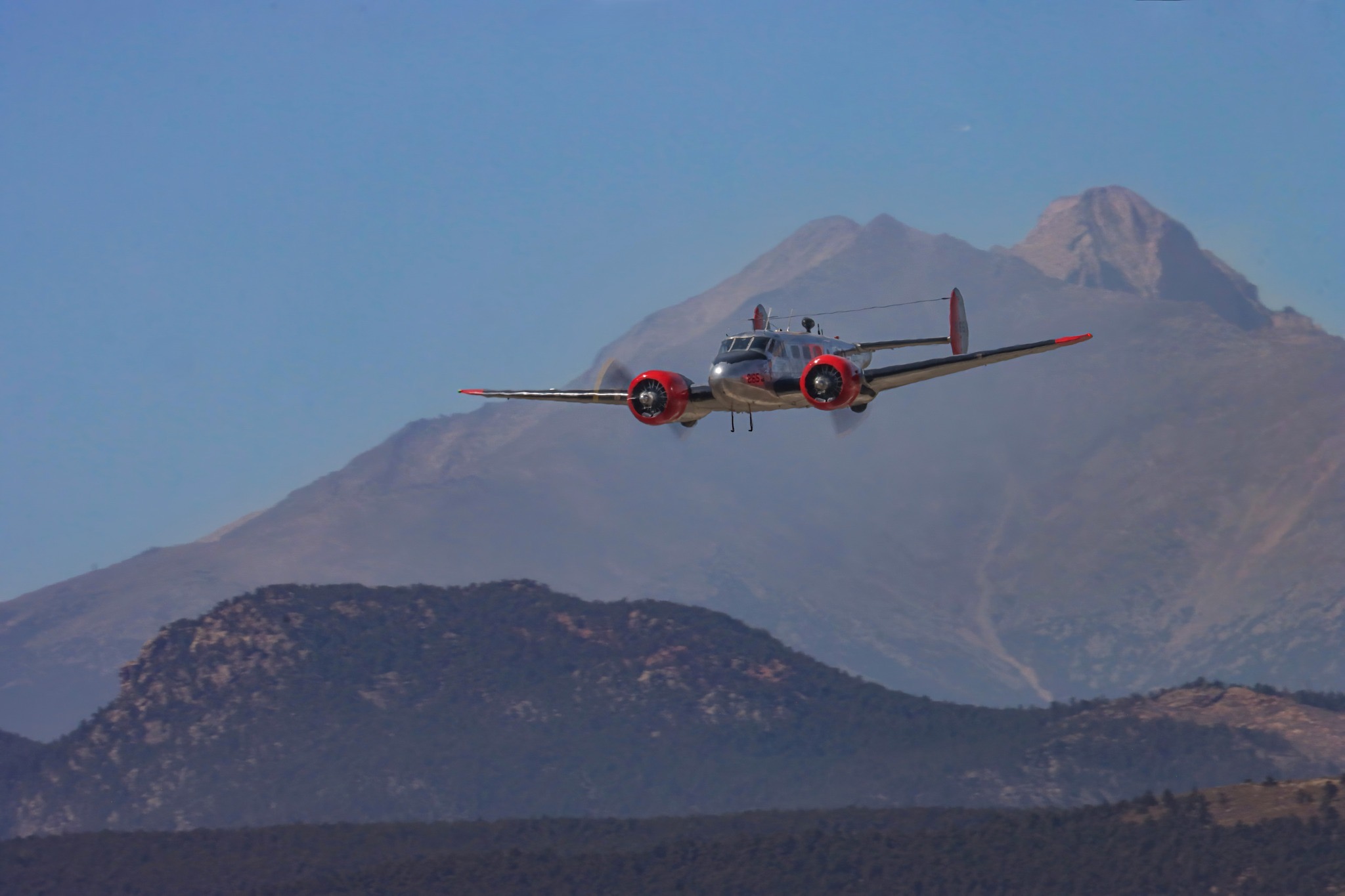 Beechcraft SNB-5 Sonoran Beauty in flight over the Colorado Rockies
