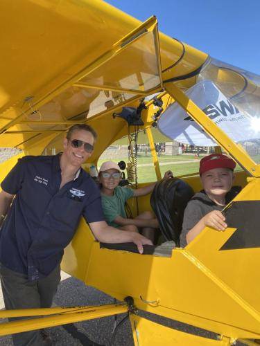 kids in the Piper Cub 