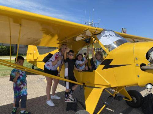 kids in the Piper Cub